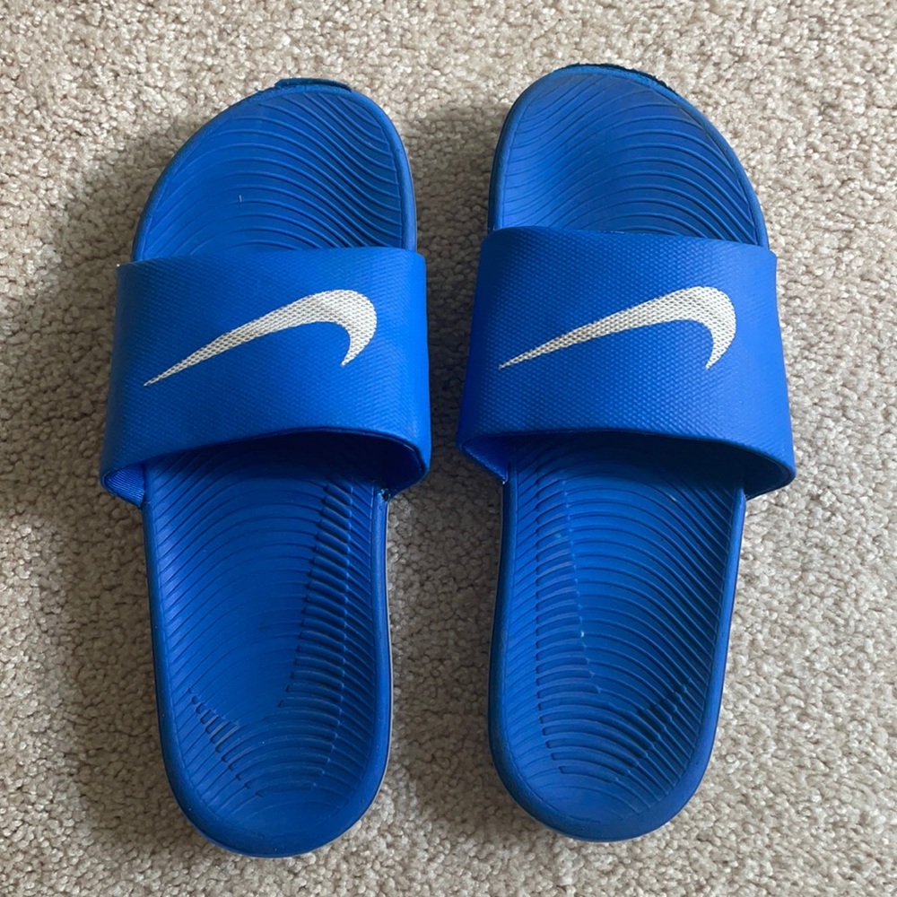 Blue Nike slides